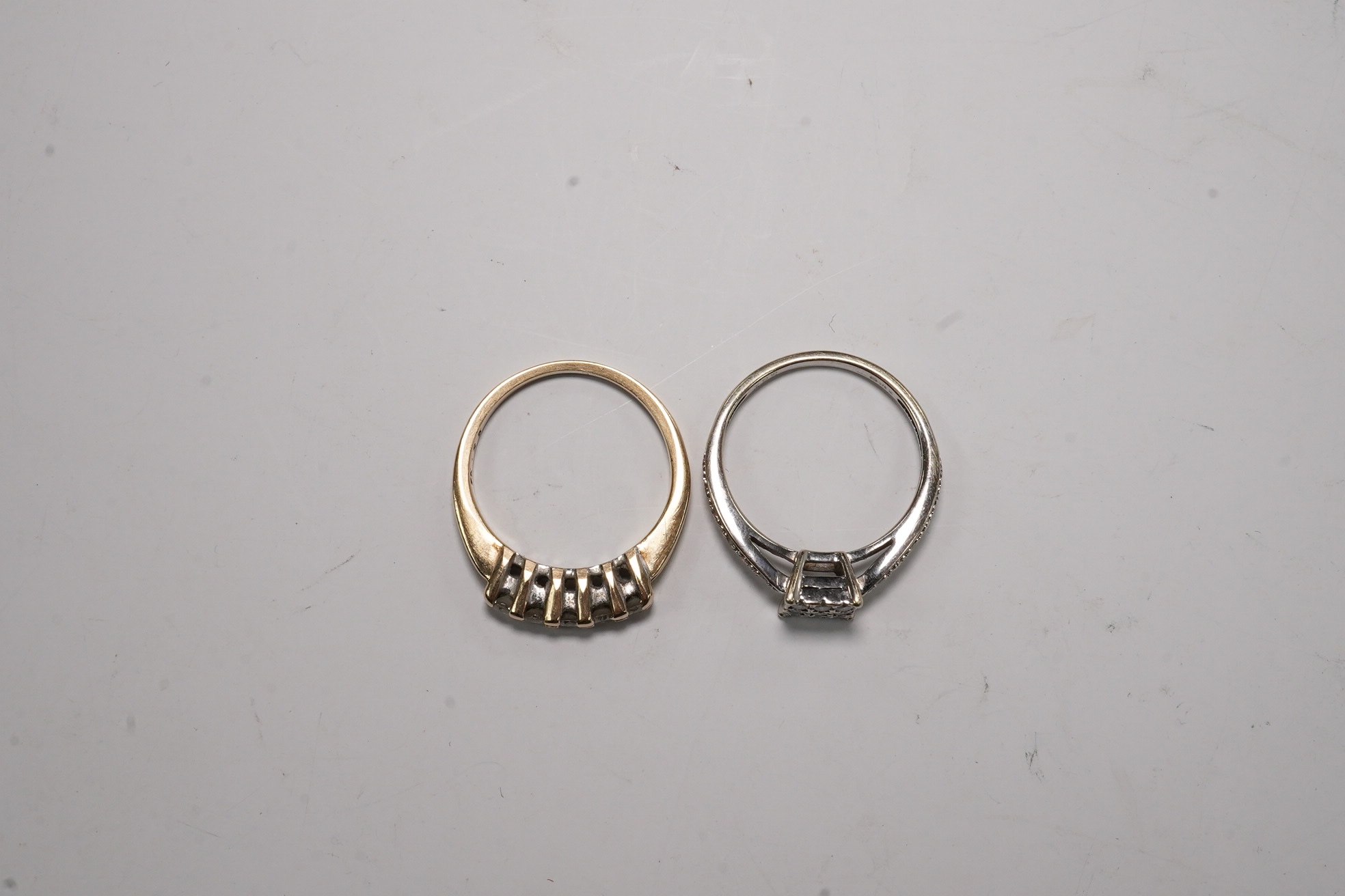 Two modern 9ct gold and diamond set rings, including square cluster and five stone half hoop, gross weight 4.2 grams.